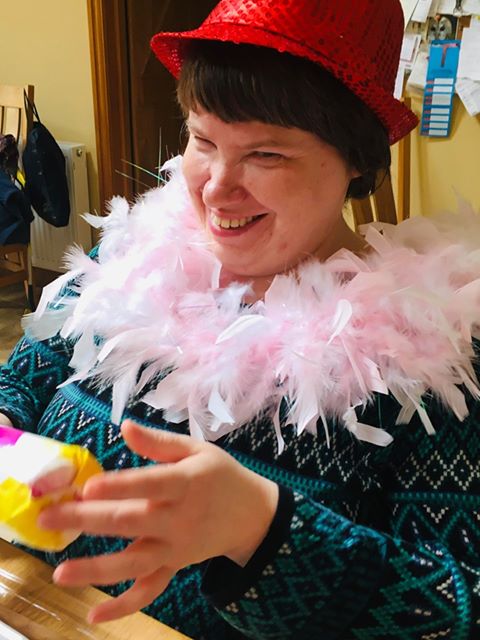 A photograph of Claire taking part in our online music-making session 