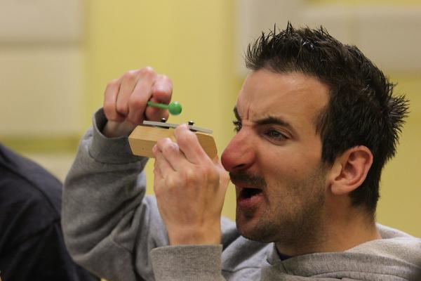 Participant playing a xylophone block in a session