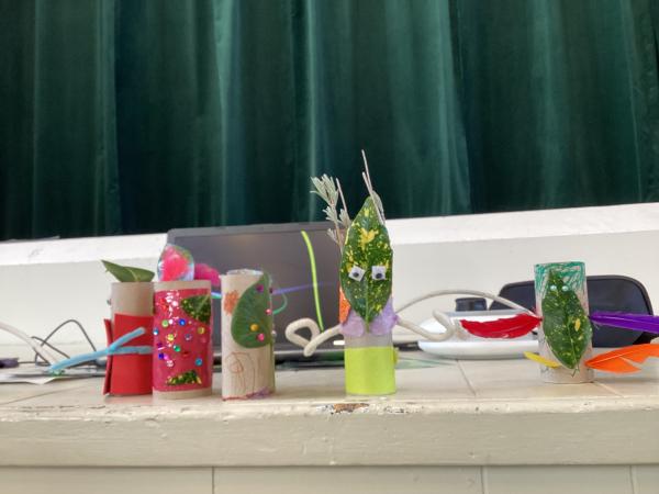 Five leafy woodland themed crafts are displayed