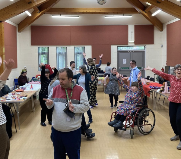 People dance together in a room