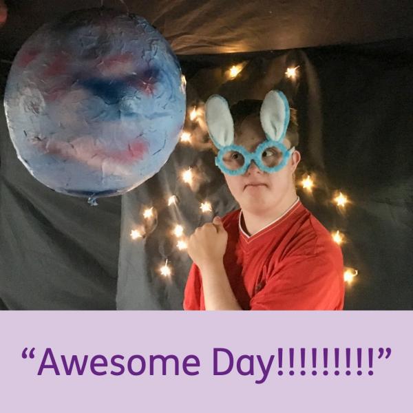 A photograph of an IMPs holiday club participant dressed up as a space man