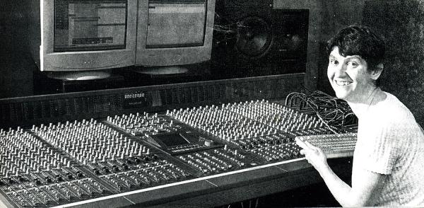 Creative Director Rose Kent behind a mixing desk at Cube Media