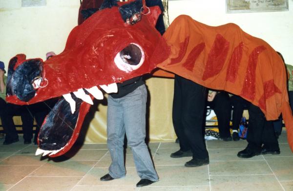 Dragon costume made by Hands & Voices participants with people inside it